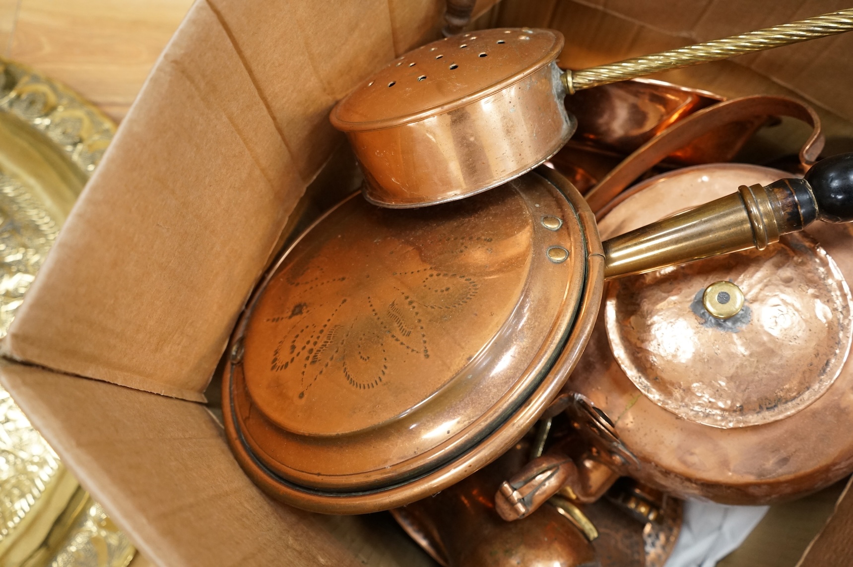 A group of metalware to include brass trays and copper warming pans
